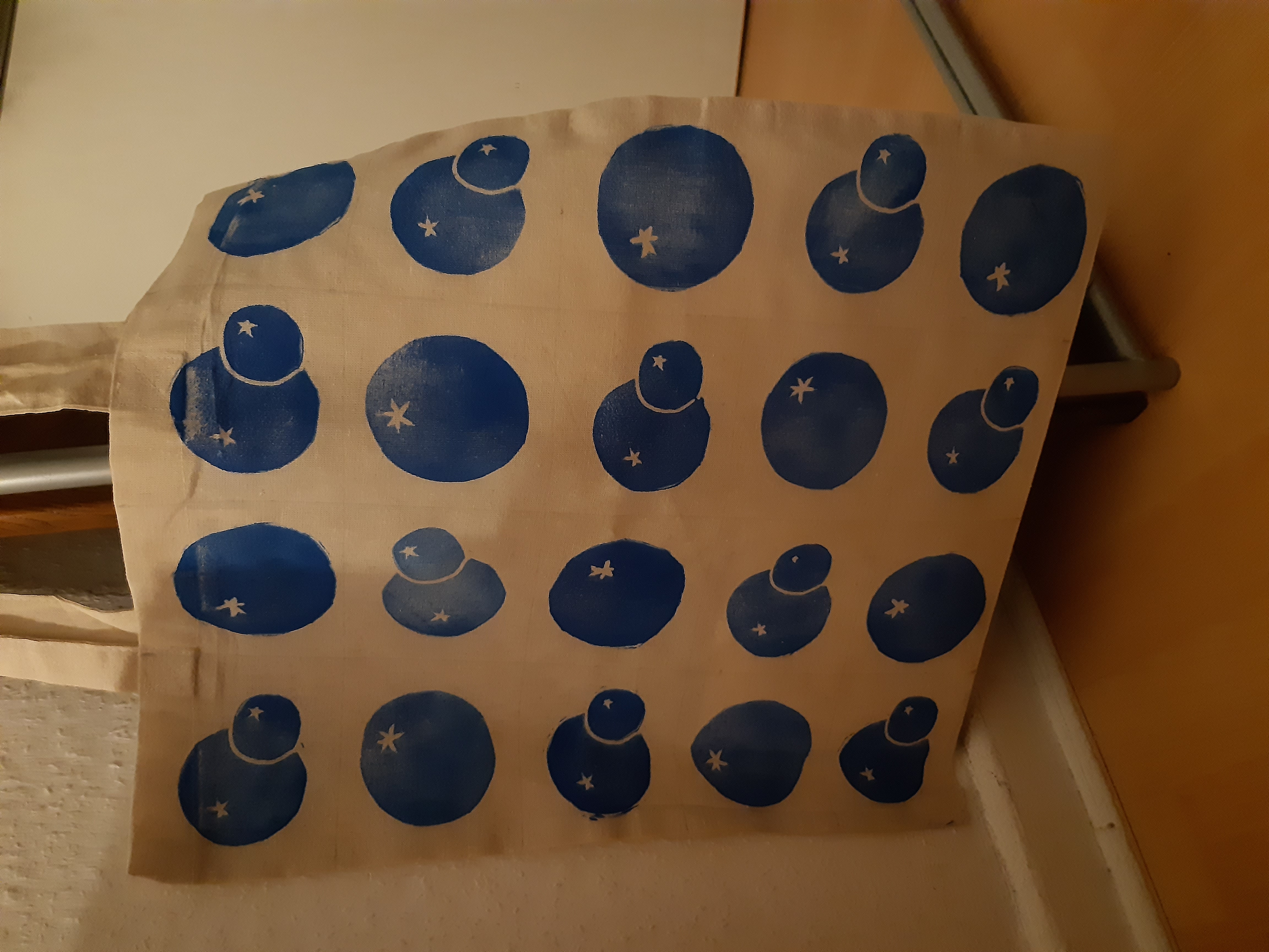 a tote bag with a blueberry pattern in straight rows and columns